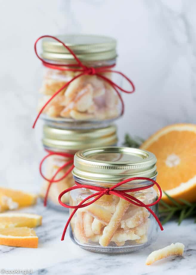 Small glass jars, filled with easy candied orange peel. Perfect for an edible holiday gift.