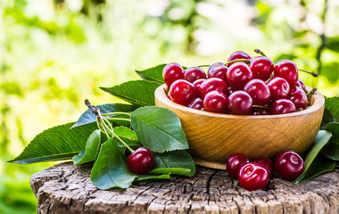 fresh cherries on wooden table